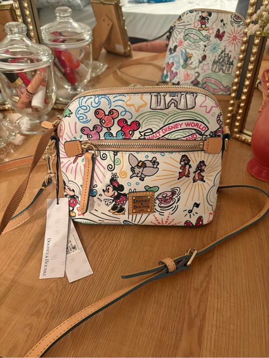 Dooney & Bourke Handbags - Dooney & Bourke White Canvas Disney Artwork Crossbody with Tan Leather Trim